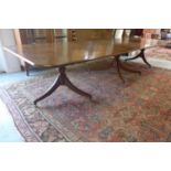 An oak triple pod dining table with two extra leaves - 72cm H x 126cm x 398cm extended