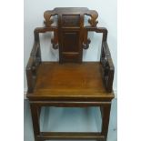 A carved hardwood Chinese open armchair with solid seat, 96cm H x 60cm x 46cm