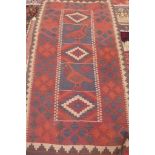 A hand knotted Kelim rug, some general usage wear, 340cm x 142cm