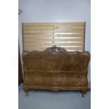 A burr walnut double bed with a slatted base - 135cm H x 184cm W - matching previous lot