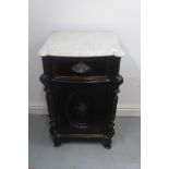 A continental marble top bedside cupboard