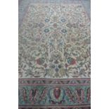 A hand knotted woollen rug with Caucasian ground and pale blue boarder, approx 388cm x 292cm -with