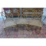 Three bamboo and wicker chairs