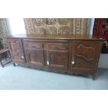 An 18th/19th Century continental walnut fruitwood sideboard with a slide over two drawers with