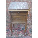 A continental marble top bedside cupboard