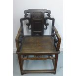 A black lacquered carved Chinese open armchair - 92cm H x 57cm x 45cm