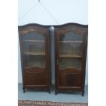 A pair of continental vitrine cabinets each with a single half glazed door, 170cm H x 80cm x 44cm