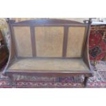 An Arts and Crafts walnut bergere hall bench - 118cm H x 151cm x 55cm