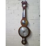 A mahogany barometer with hydrometer and thermometer above a mirror and silvered dial, the level