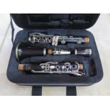 A Boosey and Hawkes, Marlborough, rosewood five piece clarinet, with fitted case, a Konig and