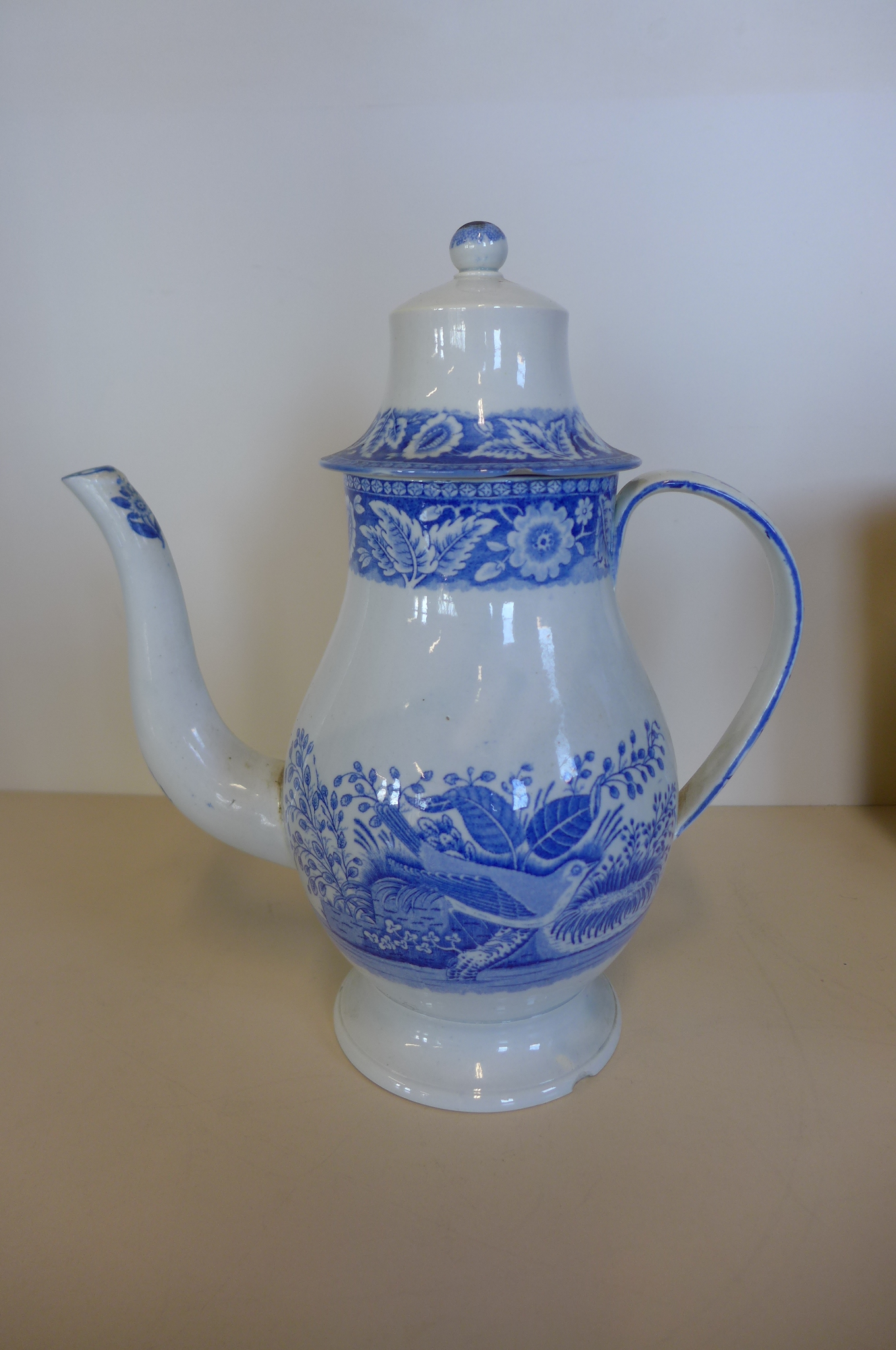 An 18th/19th Century white coffee pot 27cm tall, chip to base of pot and chips and hole to cover