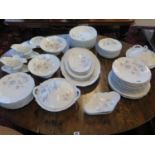 A Foliate decorated dinner service, including tureens and serving plates, 55 pieces, all have some