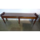 A mahogany window seat with six turned legs, 155cm W x 47cm H - made by a local craftsman to a