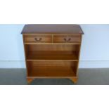 A 20th century yew wood open book case with two frieze drawers, approx 76.5cm x 82.5cmx 28cm - in