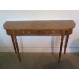 A burr walnut D shaped hall/side table with two drawers on turned reeded legs, made by a local