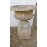 A stone effect garden urn on stand, 104cm H