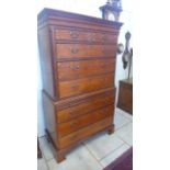 A good quality Georgian chest on chest with inlaid drawer fronts, an arrangement of two short over