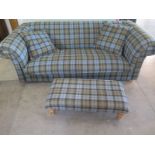 A bespoke made three seater sofa in a tartan material - 70cm H x 215cm W x 105cm with footstool