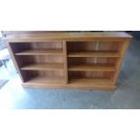 A modern bookcase with two banks of shelves, approx 168cm wide, 91cm tall, 28cm deep