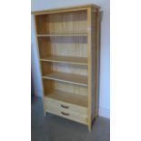 A light wood effect wicker bookcase - 161cm H x 86cm x 32cm