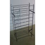 An iron wine rack 107cm H x 53cm W