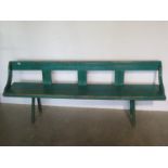 A Vintage painted bench in old green paint, mounted on hand cut legs, woodworm treated - 184cm long,