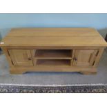 An oak two drawer TV unit - W120cm x D44cm x H50cm