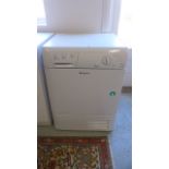 A Hotpoint Aquarius TCM570 tumble dryer in working order