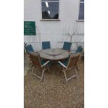 A Technique Club teak garden table with lazy Susan and six chairs, chairs recline, table diameter