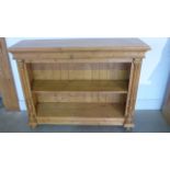 A reproduction pine bookcase with applied columns, mounted on bun feet - Waxed - 93cm H x 123cm x