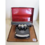 An early 20th century - Write Easy - typewriter in working order with spare ribbon and original case