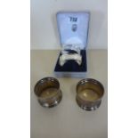 A boxed pair of silver napkin rings, with Greek key decoration and another silver pair, approx 1.1