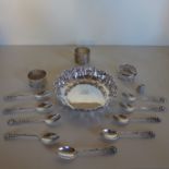 A sterling silver planished dish with monogram together with three silver napkin rings of