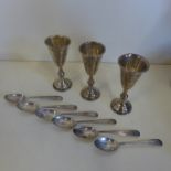 Three small silver cups together with six silver teaspoons, approx 4.3 troy oz, two of the cups in