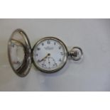 A silver Everite half hunter pocket watch 50mm wide, clean running order, no interior glass