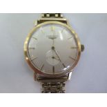 A 9ct gold gentlemens automatic wristwatch, with baton markers, and subsidiary dial, case approx