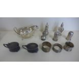 A collection of silver including a sauce boat, three napkin rings, a pair of salts and five