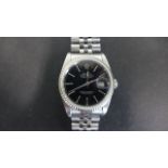 A gents Oyster perpetual Datejust Rolex - stainless steel wristwatch with black dial, 37mm wide