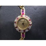 An 18ct ruby and diamond Bueche Girod ladies bracelet wristwatch with quartz movement, 18mm wide,