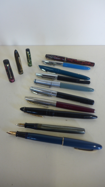 A collection of various fountain pens, including two with 14ct gold nibs, a Sheaffer and a