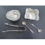 Two silver bonbon dishes, a silver mustard spoon and a plated spoon, also a pair of silver nips,