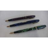 Three Conway Stewart fountain pens with 14ct gold nibs, of different designs, cases in good