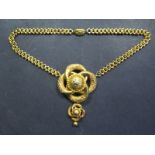 An ornate gold link pendant necklace, 42cm long, tests above 9ct, approx 20grams