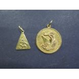 An 18ct gold St Christopher pendant - approx 2.8grams - and a chinese gold pendant, tests to