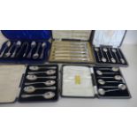 Five cased sets of silver flatware, including a set of six teaspoons with sugar tongs and another