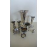 A collection of silver items, a milk jug, trinket box, pair of small vases, one with a weighted