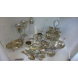 An assortment of plated wares, two goblets, candle holder, with snuffer, a cut glass