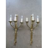 A pair of good quality three branch brass wall lights - 59cm High