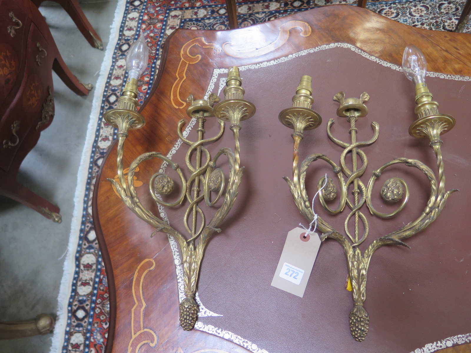 A pair of ornate two branch wall lights - 40cm high