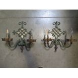 A pair of metal two branch wall lights